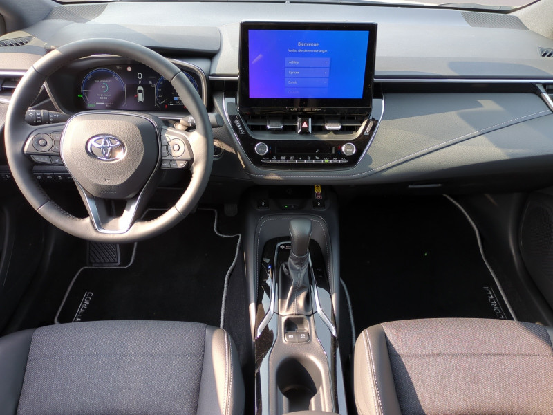 Photo 4 de l'offre de TOYOTA COROLLA TOURING SPT 1.8 140CH DESIGN MY25 - 24 % à 29999€ chez Automobiles 25