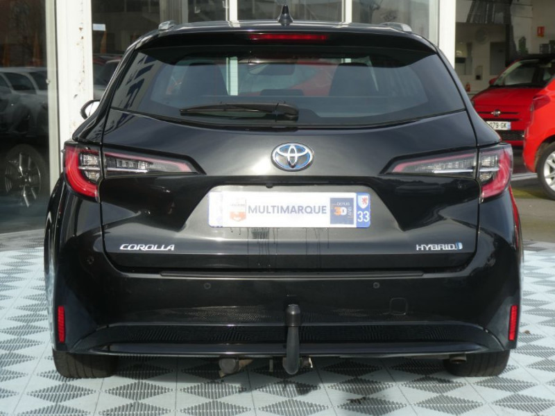 Photo 10 de l'offre de TOYOTA COROLLA XII TOURING SPORTS 1.8 HYBRIDE 122H BVA DYNAMIC Key Less Induction Radars Attel. à 21750€ chez Mérignac auto