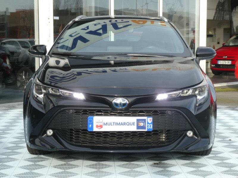 Photo 9 de l'offre de TOYOTA COROLLA XII TOURING SPORTS 1.8 HYBRIDE 122H BVA DYNAMIC Key Less Induction Radars Attel. à 21750€ chez Mérignac auto