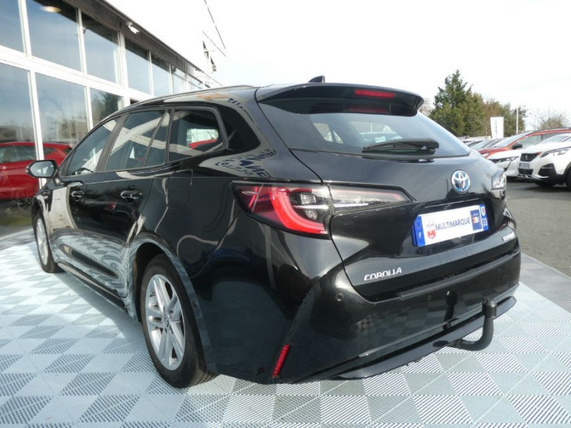 Photo 11 de l'offre de TOYOTA COROLLA XII TOURING SPORTS 1.8 HYBRIDE 122H BVA DYNAMIC Key Less Induction Radars Attel. à 21750€ chez Mérignac auto