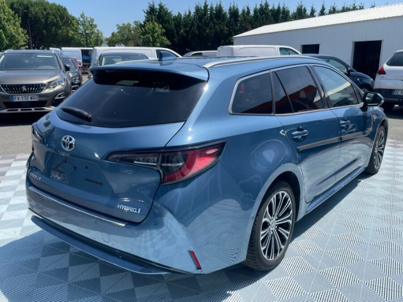 Photo 3 de l'offre de TOYOTA COROLLA XII TOURING SPORTS 1.8 HYBRIDE 122H BVA PREMIUM CUIR 4SC Hayon EL. JA17 à 24950€ chez Mérignac auto