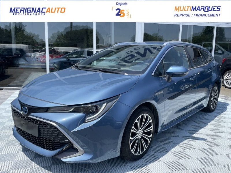 Photo Toyota COROLLA XII TOURING SPORTS 1.8 HYBRIDE 122H BVA PREMIUM CUIR 4SC Hayon EL. JA17 Hybride BLEU DENIM METAL en vente chez Mérignac auto Toyota COROLLA XII TOURING SPORTS 1.8 HYBRIDE 122H BVA PREMIUM CUIR 4SC Hayon EL. JA17 Hybride BLEU DENIM METAL Occasion à vendre